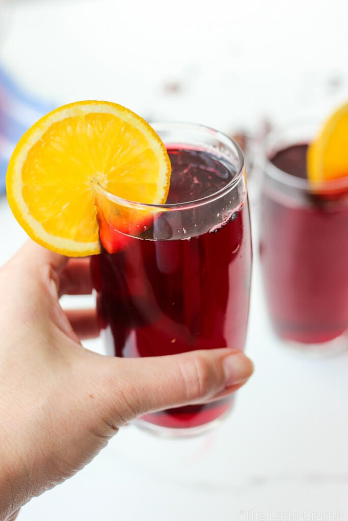 Floral, naturally deep red, and irresistibly refreshing. This agua de Jamaica recipe is made with dried hibiscus flowers, sugar, and warm spices. Classic and easy.