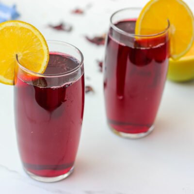 Floral, naturally deep red, and irresistibly refreshing. This agua de Jamaica recipe is made with dried hibiscus flowers, sugar, and warm spices. Classic and easy.