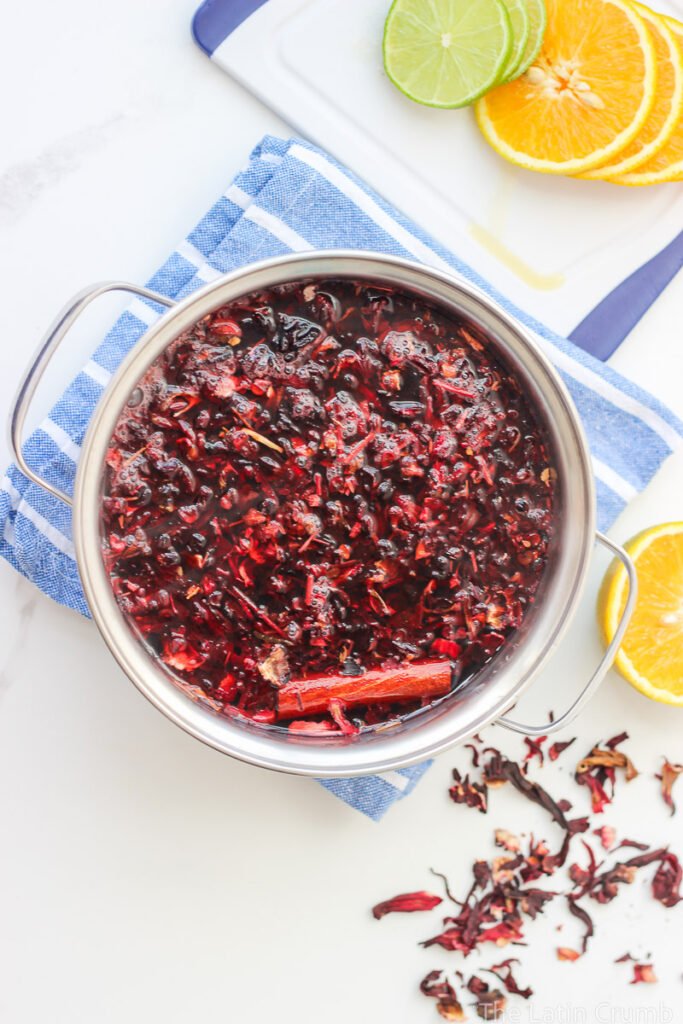 Floral, naturally deep red, and irresistibly refreshing. This agua de Jamaica recipe is made with dried hibiscus flowers, sugar, and warm spices. Classic and easy.