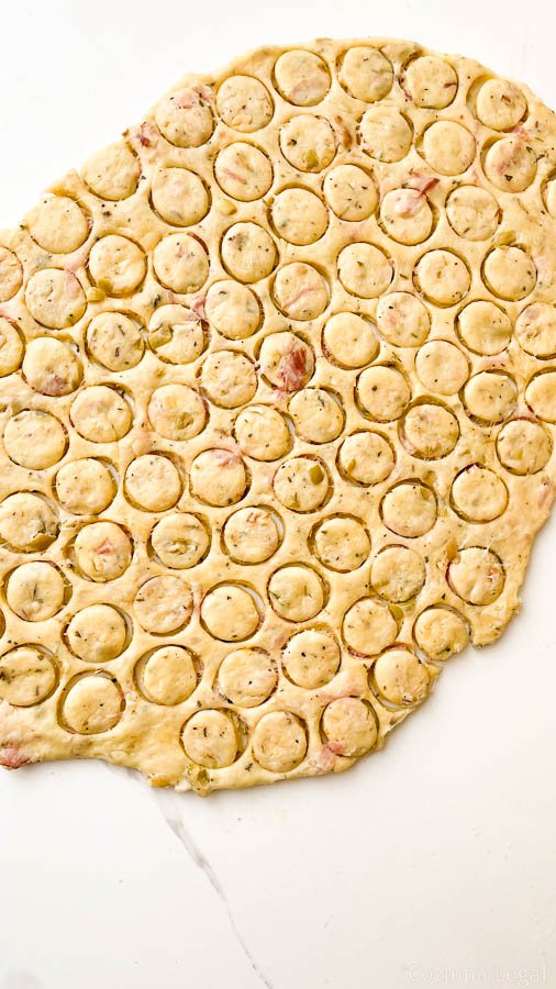 These crispy, savory homemade biscuits are packed with smoky bacon, salty parmesan, and briny olives. One bowl, no mixer, and on the table in under 30 minutes.